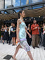 Frost Petal — side runway view showing the printed hem